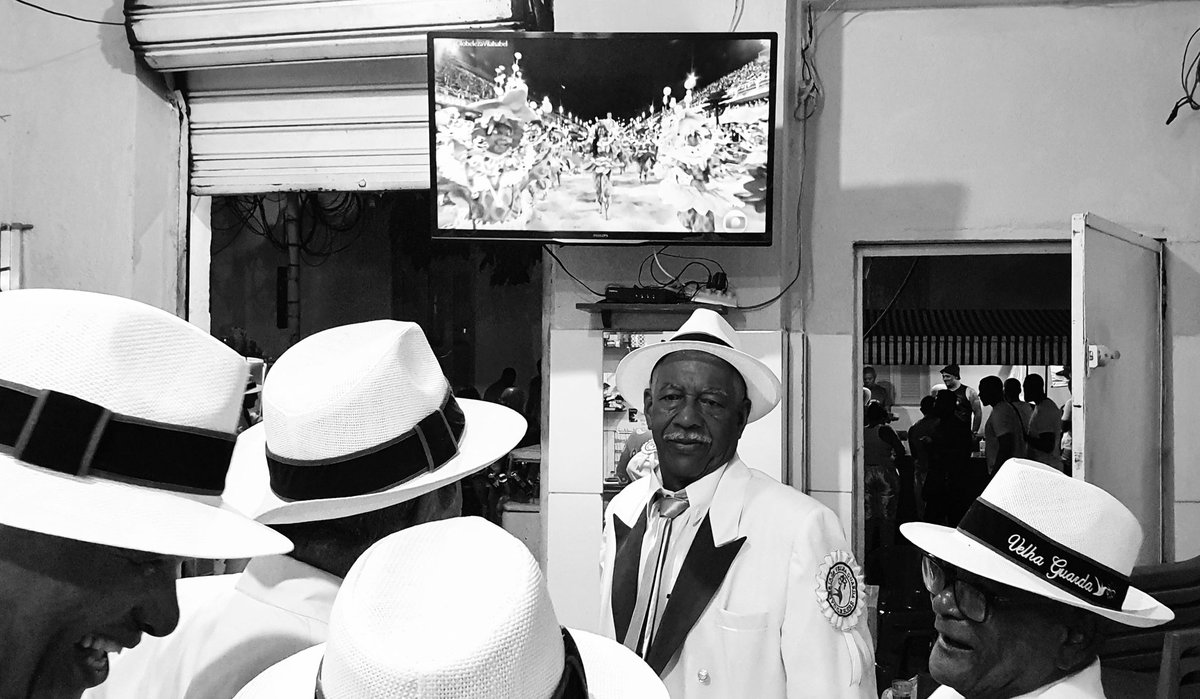 Members of the #velhaguarda (senior section?) of the #beijaflor2023 samba school prepare to enter the #sambodromo in #RiodeJaneiro #Brazil at a nearby bar, early Tuesday (Feb 21). The samba school (team) finished 4th in the annual competition.