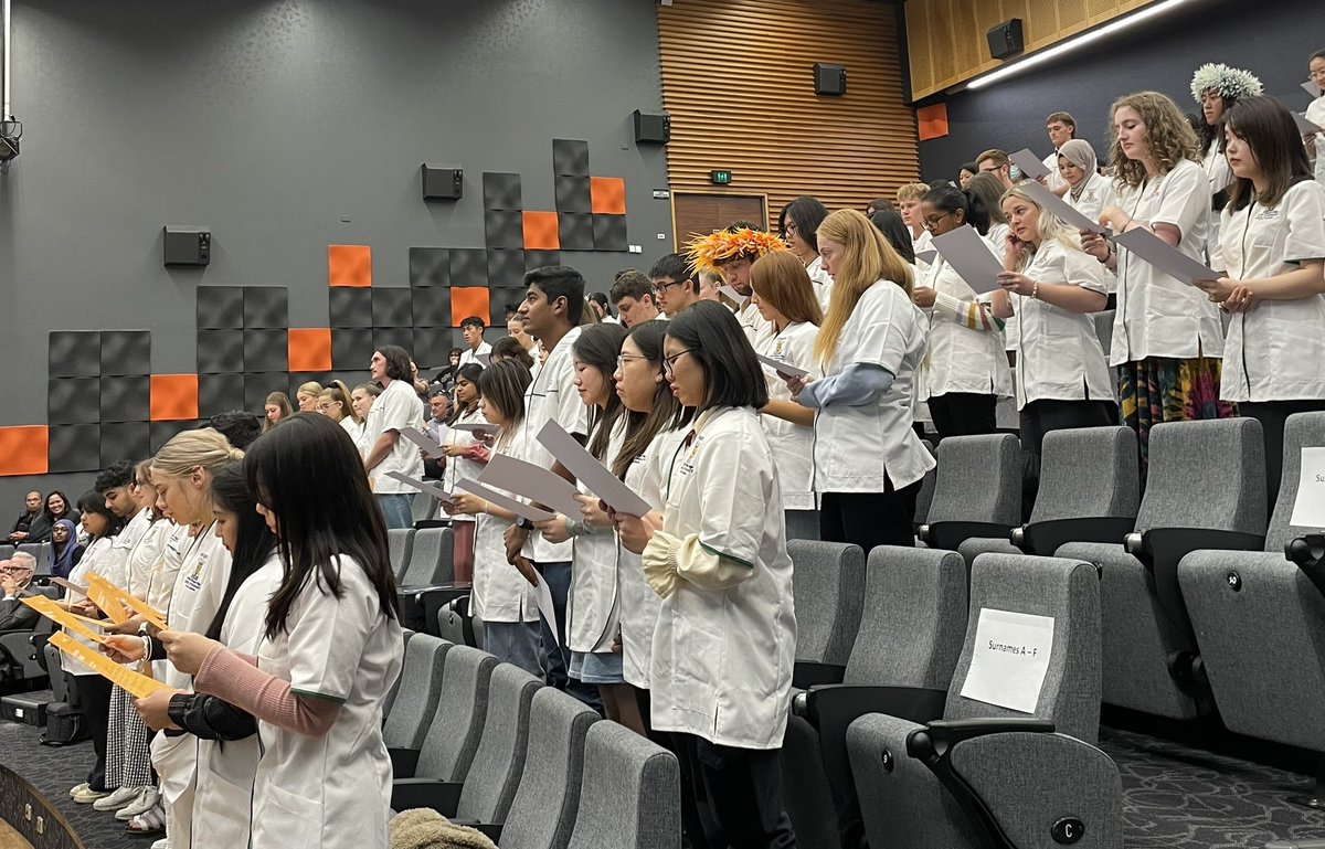 OtagoPharmacy's tweet photo. New pharmacy students reciting the Code of Conduct for Pharmacists as part of White Coat Ceremony 2023 https://t.co/34TLGWEvhI