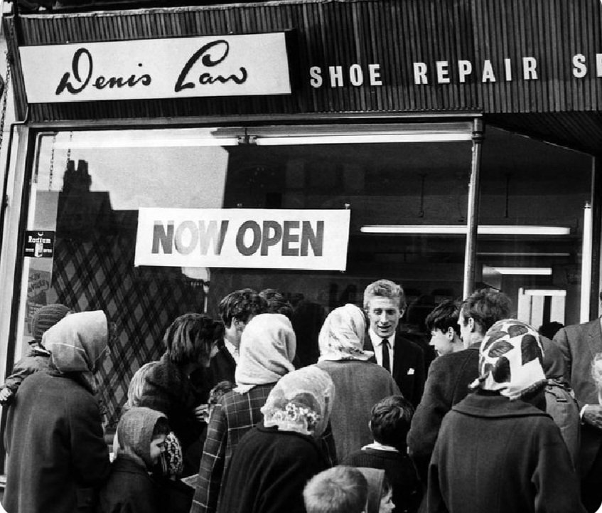 Happy Birthday Denis Law, 83 today. What a player.

Here he is opening his shop on Moston Lane. 