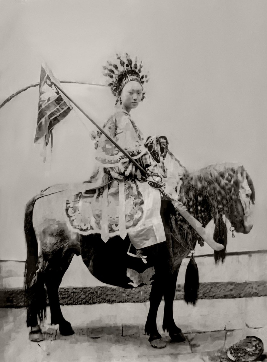 Does anyone know the origins of this flag and headdress? It was an image from an Upper Yangtze album c. 1900?