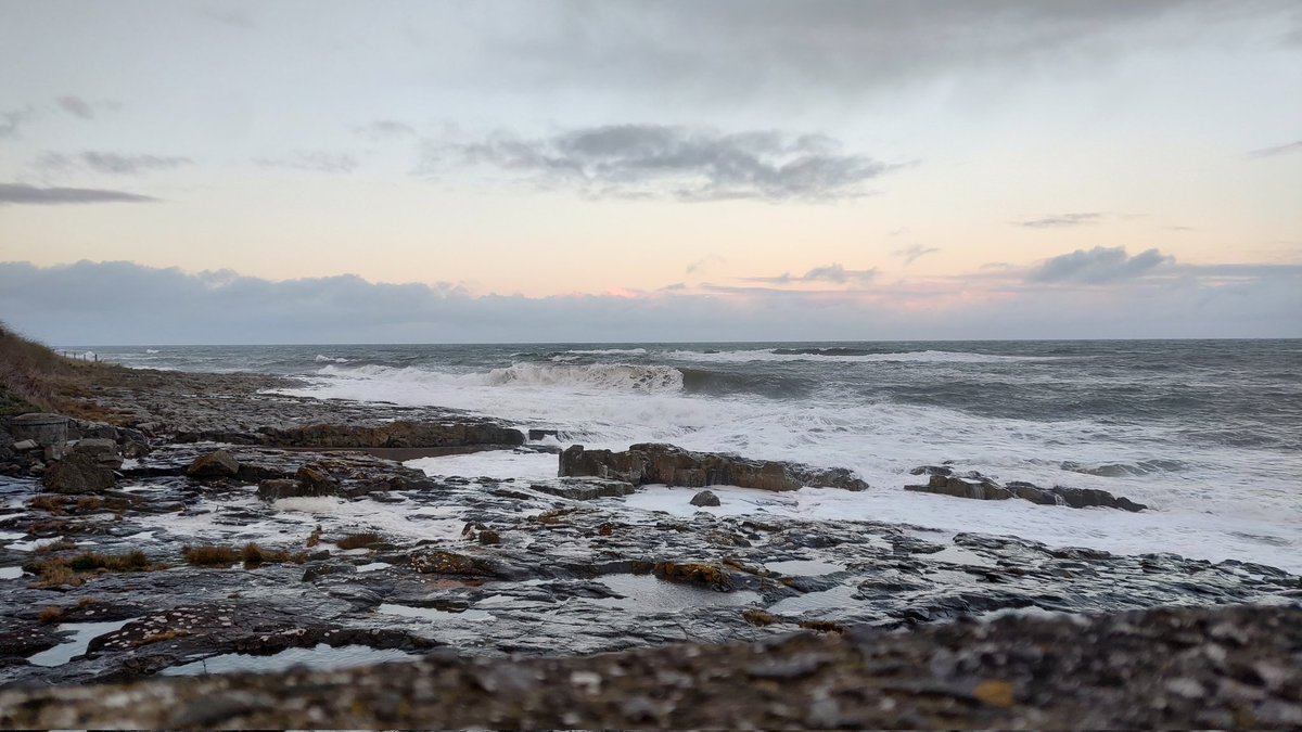 Craster Harbour and Dunstanburgh in the distance #UKtrip #TravelBlog