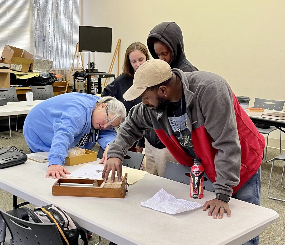 NWCC_Library's tweet image. We had SO much fun with Ms. Lentz and her adult basic education class today! They received a library tour and demonstrated their problem-solving skills during our 1980’s spy-themed escape room.
