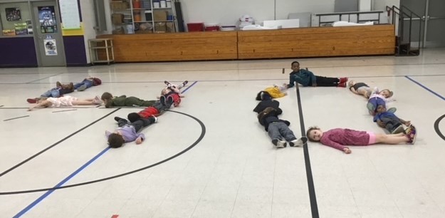 Today, my Kindergarten class "lined up" (to leave PE) a little differently than usual -- We wanted to make a special birthday message for their teacher to see when she arrived to pick them up from the gym! Any guesses as to how old their teacher is now? 🤔🧐 🥳