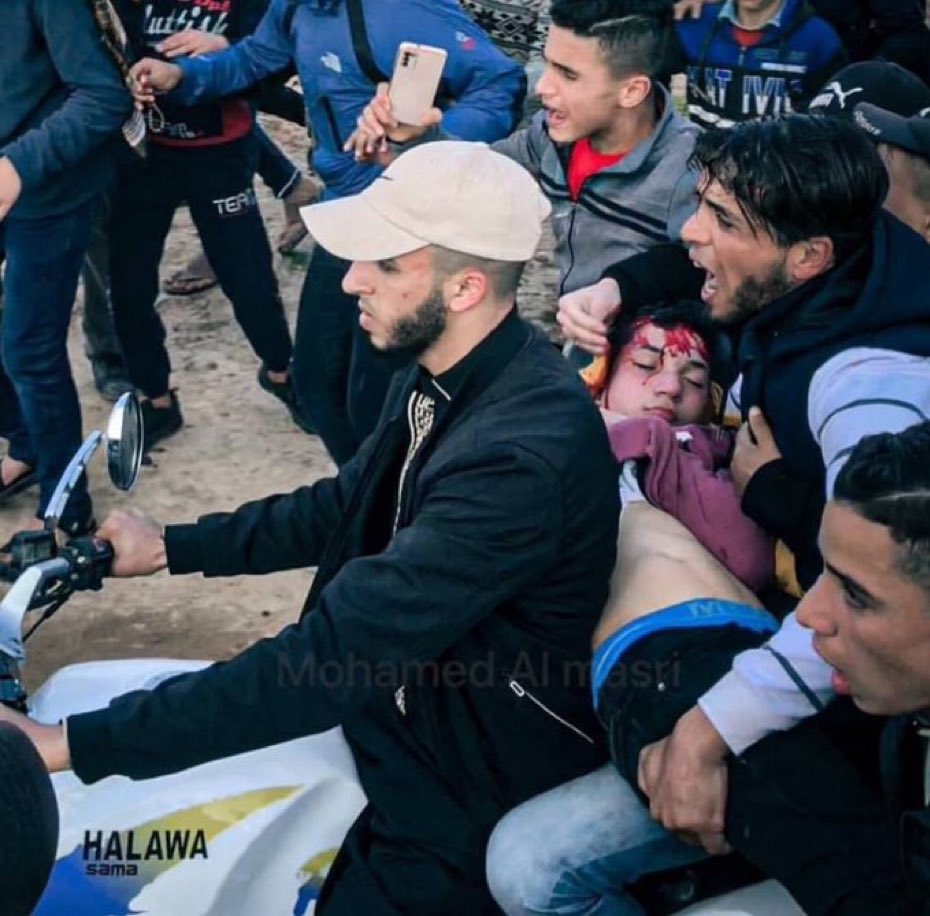 PalMediaOrg's tweet photo. Israel sniper shoots dead Palestinian kid in Gaza. What was his crime. Being Palestinian. It’s as simple as that: Who can stop Israel? https://t.co/6bssj69M90