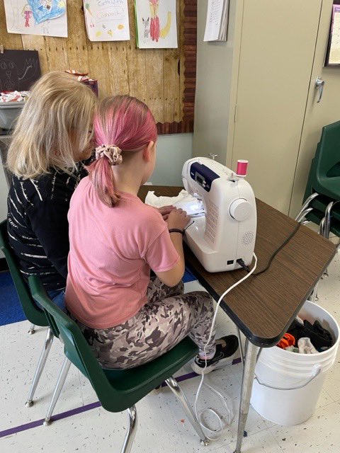 3rd graders repurposing t-shirts into bags!