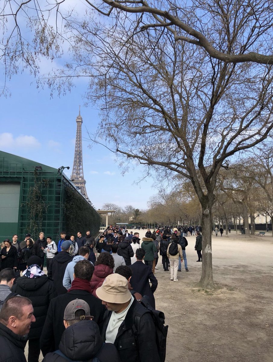 Wow, I've never seen so many people lining up for a funeral! Oh wait, it's just the line to get into NFT Paris. But yeah, NFTs are totally dead... 😏