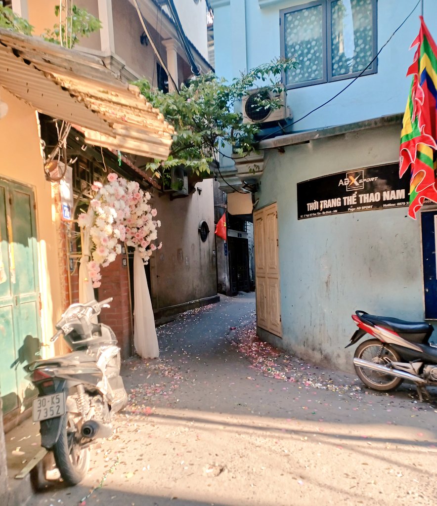 Kate_Caliope's tweet photo. The alleyways in Hanoi are twisty, and full of surprises, such as this wedding arch. The alleys will be ringed with glitter for days, adding a bit of glamor to dusty streets. The confetti dances in the wind, and motorbikes honk their congratulations. Magical. https://t.co/LNKIf48dST