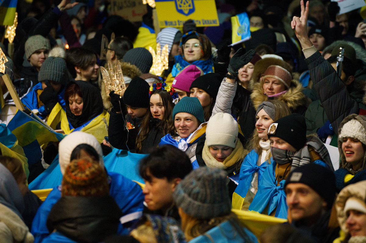JustinTrudeau's tweet photo. A year ago, Ukrainians woke up to the horrors of war. But that day and every day since, they’ve stood strong. And we’re standing with them. Together with the @ukrcancongress, we came together to show our support – and to remind Ukrainians that we’ll always be here for them. https://t.co/e5KSZudXFW