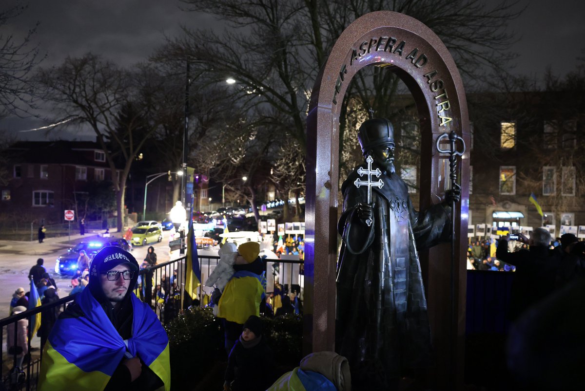 To mark the one year anniversary of the war in Ukraine, people honor the victims and protest against the war outside of Saints Volodymyr and Olha Ukrainian Catholic Church in Chicago’s Ukrainian Village neighborhood on Friday.