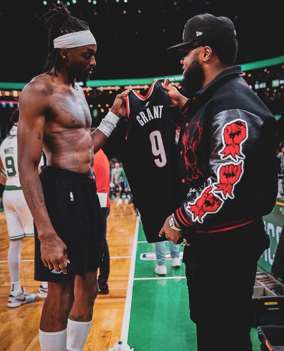 DeMathaCatholic's tweet photo. Jerami Grant '12 of the Portland Trailblazers handing his jersey to Ja'Whaun Bentley '14 of the New England Patriots. Stags! https://t.co/51t5NslmUP