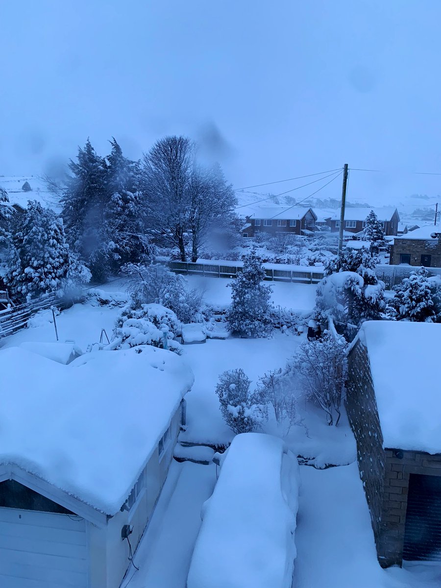 Calvinotis's tweet image. I’ve a feeling I’ll have to use the front door today. Direction of snow against my porch door. Bedroom window and view from same #HD9 #Holmfirth #snow
