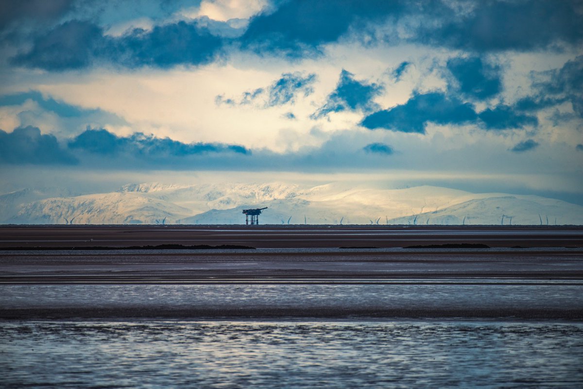 Granny's Bay Fairhaven Fylde Coast to Snowdon National Park over 100miles away with Liverpool Bay gas rig and a snow capped Mt Snowdon in the background.

Image (c) Copyright Roger Moore Photography 2023