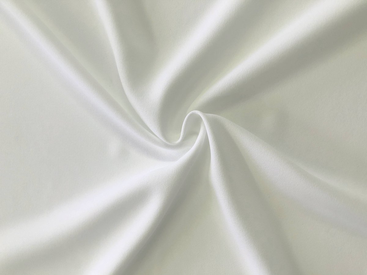 'Prowess' our new mechanical stretch crepe is now available to order on the New Fabrics section of our website at carringtonfabrics.co.uk #carringtonfabrics #bridalfabric #fashionfabrics #stretchfabric #stretchcrepe #dressfabric