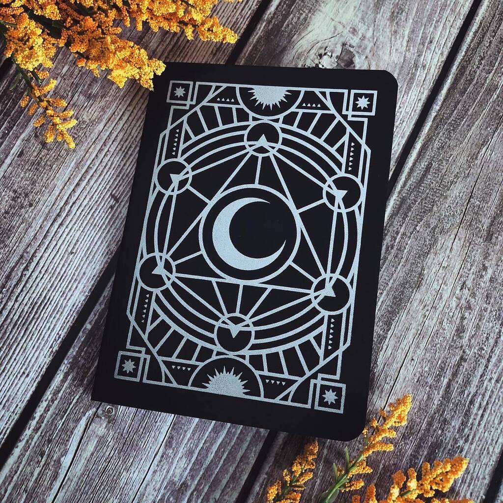🔮✨ Introducing the new version of our Spellcaster notebooks! We're thrilled to share that these beauties (designed by us) are now fully made in Canada with improved recycled paper and a sturdier cover. Featuring arcane designs handprinted with silver… instagr.am/p/CpnYWhCuyUF/