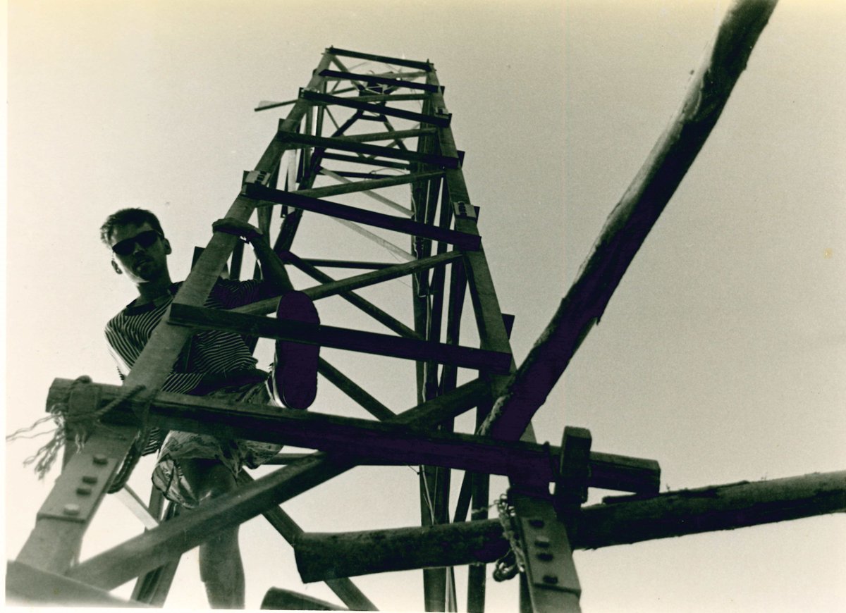 Me climbing the windphone tower at @glastonbury 1994. 🎪 “The last few years I went to Glastonbury I did something creative, radical and fun... I got an old electricity pylon (20m tall) and some train batteries from a scrap yard, stuck a windmill on top, linktr.ee/therealdalevin……