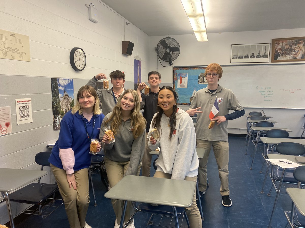 ViatorCulture's tweet photo. It's Modern World Language week at Saint Viator High School. These are our Honors French IV students enjoying pain au chocolat! #svhs #MWLweek #viatorculture https://t.co/aZDU3qg5D4