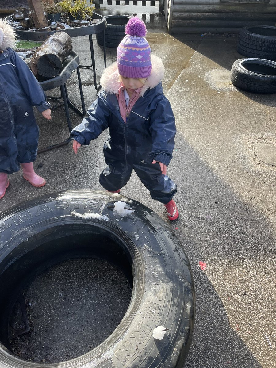 Sometimes you just have to stand in the way of the sunshine to protect your tiny snowman from melting!