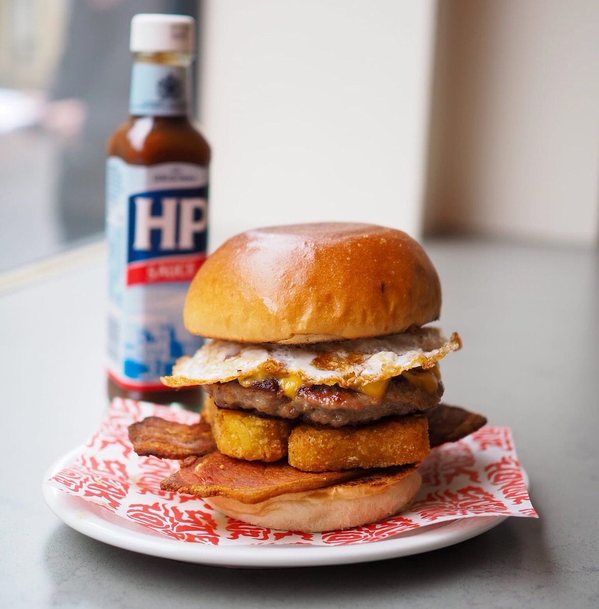 steakandhonour's tweet photo. Get a load of this! The Big Breakfast Bun.  Sausage patty, 2 x bacon, 2 x hash browns, American cheese &amp; fried egg.  Available for takeaway + on all delivery platforms Sat 9.30-11.30. If you’re having a big one tonight, you’ve just found the perfect hangover cure.👌🏽

📷 @Smadz_ https://t.co/1ilQuI83oQ