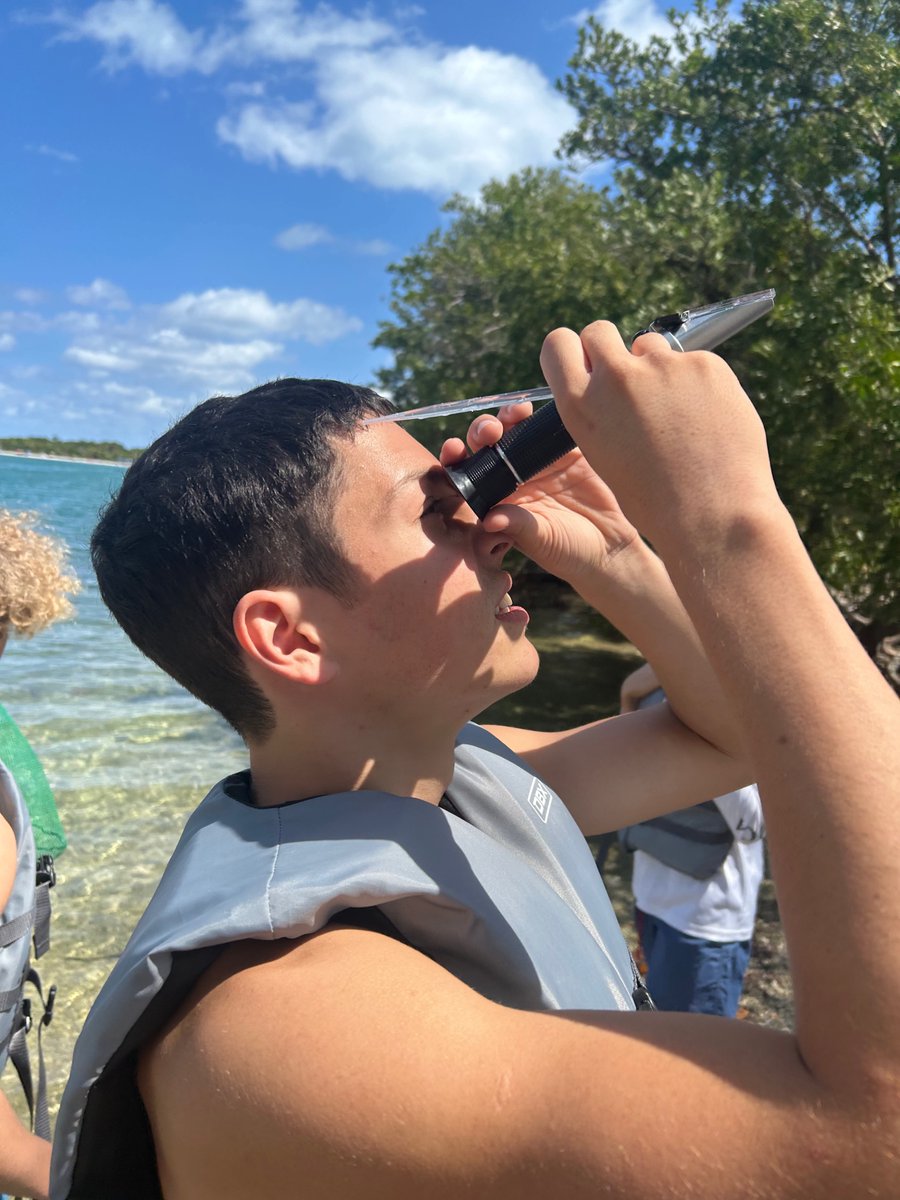 Learning at the Biscayne Bay. Oleg measuring the salinity of water using a refractometer. #STEMEducation #MASTatFIU #MarineScience #ConnectandInspireMDCPS