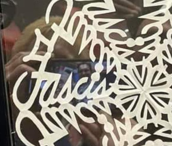 SteveGoffman's tweet image. At a Republican political rally in Davenport, Iowa today someone gave @GovRonDeSantis and @IAGovernor Kim Reynolds a handmade “snowflake” with the word "Fascist" secretly embedded in it.