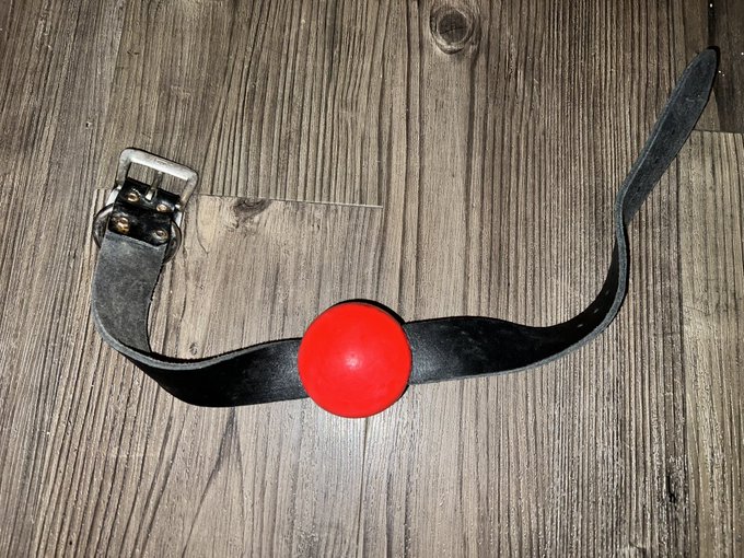 For Sale NOW! Large red ball gag with wide black leather strap worn in many shoots & movies! Serious