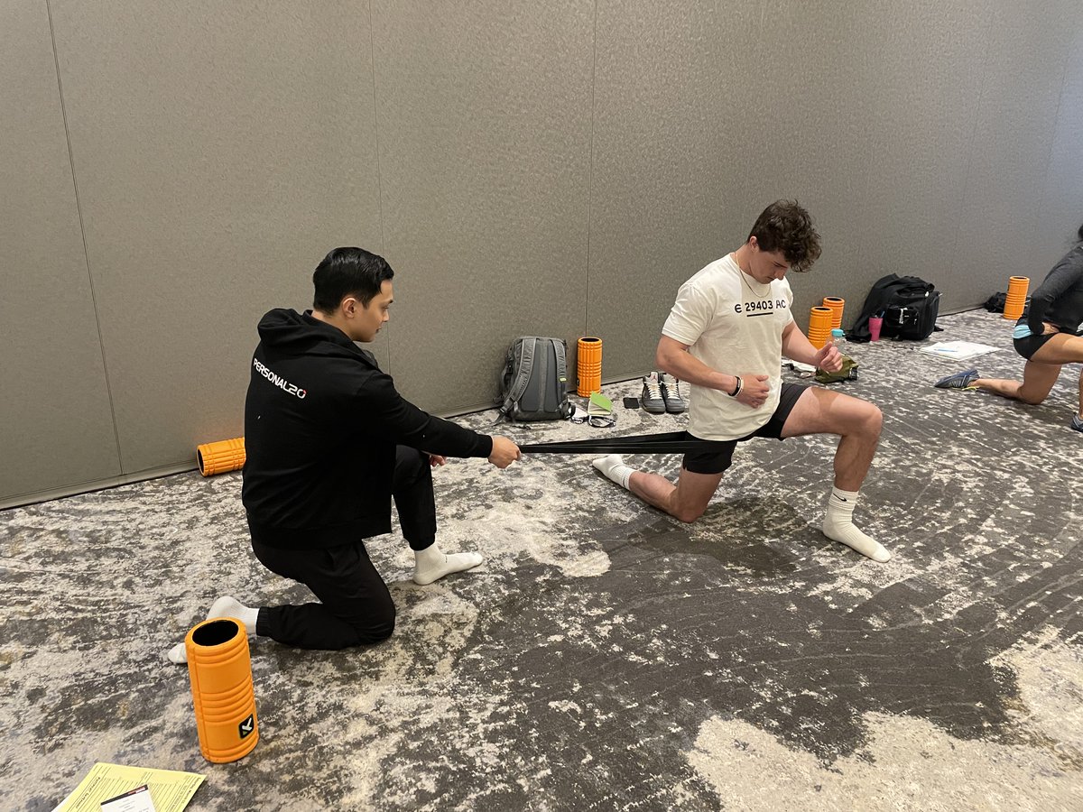ideafit's tweet photo. Attendees practicing hip distraction techniques during Greg Johnson's session on prepping the body for power, strength and big lifts. ๐๏ธโโ๏ธ๐ช
#ideapti #pti23 https://t.co/kTYCa4Jgzs