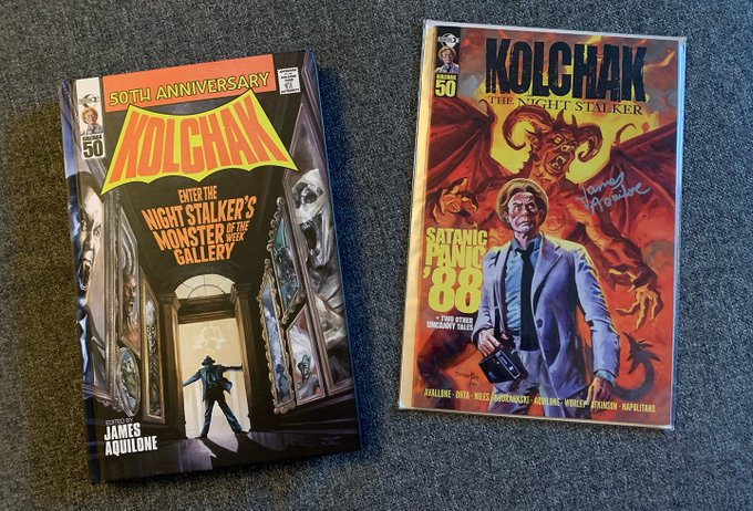 On the left is a 200+ page hardcover graphic novel celebrating the 50th Anniversary of Kolchak, the Night Stalker. On the right is the Satanic Panic '88 Kolchak the Night Stalker one shot comic.  The hardcover cover features Carl Kolchak, in the doorway entrance to a hallway lined with paintings, each one feature one of the creatures from the tv show. It's also an homage to a famous Batman Rogues gallery cover. On the right, the comic features Kolchak in a light suit and tie, porkpie hat, holding his recorder, while a red, horned, winged demon stands behind him.