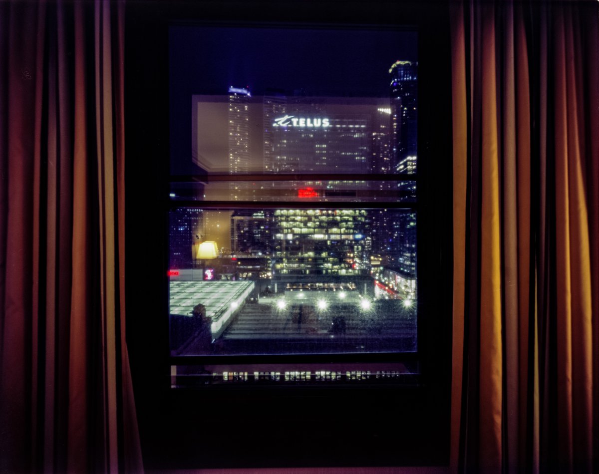 Hotel room pinhole No. 4: @FairmontRYH . The red blob in the center is its sign, which once dominated Toronto's skyline, reflecting off of the new towers. A couple of hours exposure with the lights on then overnight (@ILFORDPhoto Harman TiTAN 4x5, @KodakProFilmBiz Ektar 100)