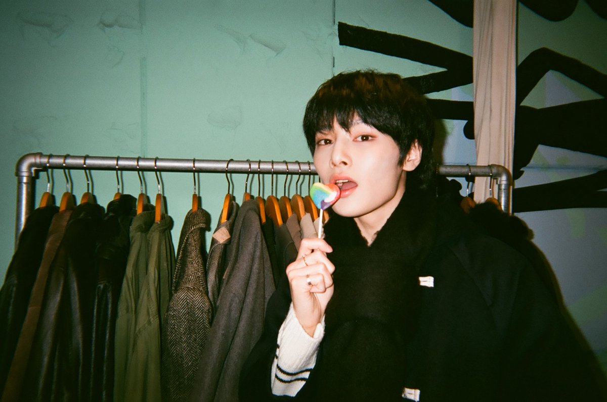 “The lollypop and the face poised to consume it are both lovely.” 🐈%  when blended with candies as nourishment and decorations, the dim lighting in the photograph enhances to how splendid it seems, ultimately impressing onlookers. 🍮🥢 ˖ ࣪