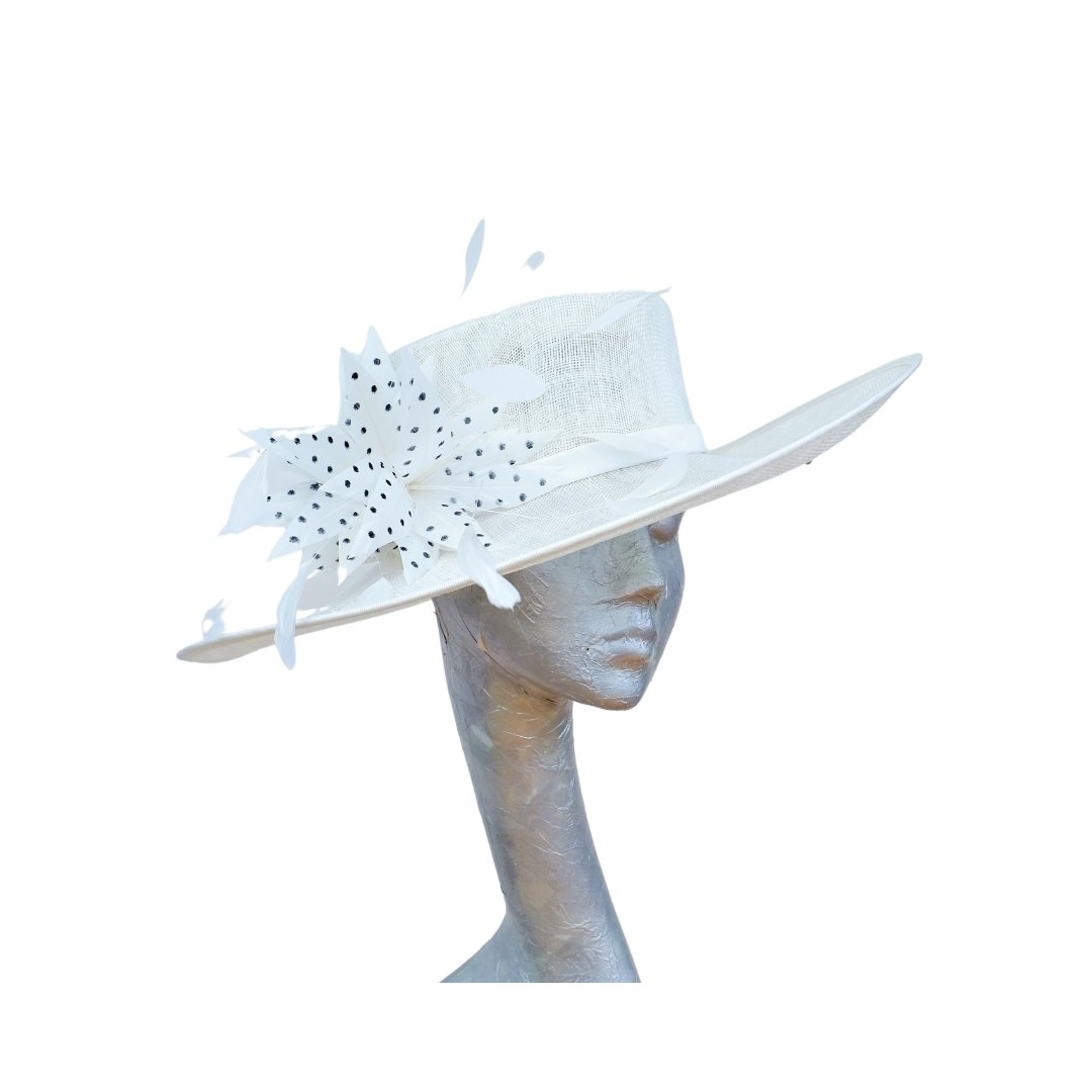 It's a busy time at the moment Millinery everywhere here is an Ivory feature hat with Ivory & Black polka dot feather detail completed yesterday....
#churchhat #motherofthebride #weddinghat #racedayfashion #millinery