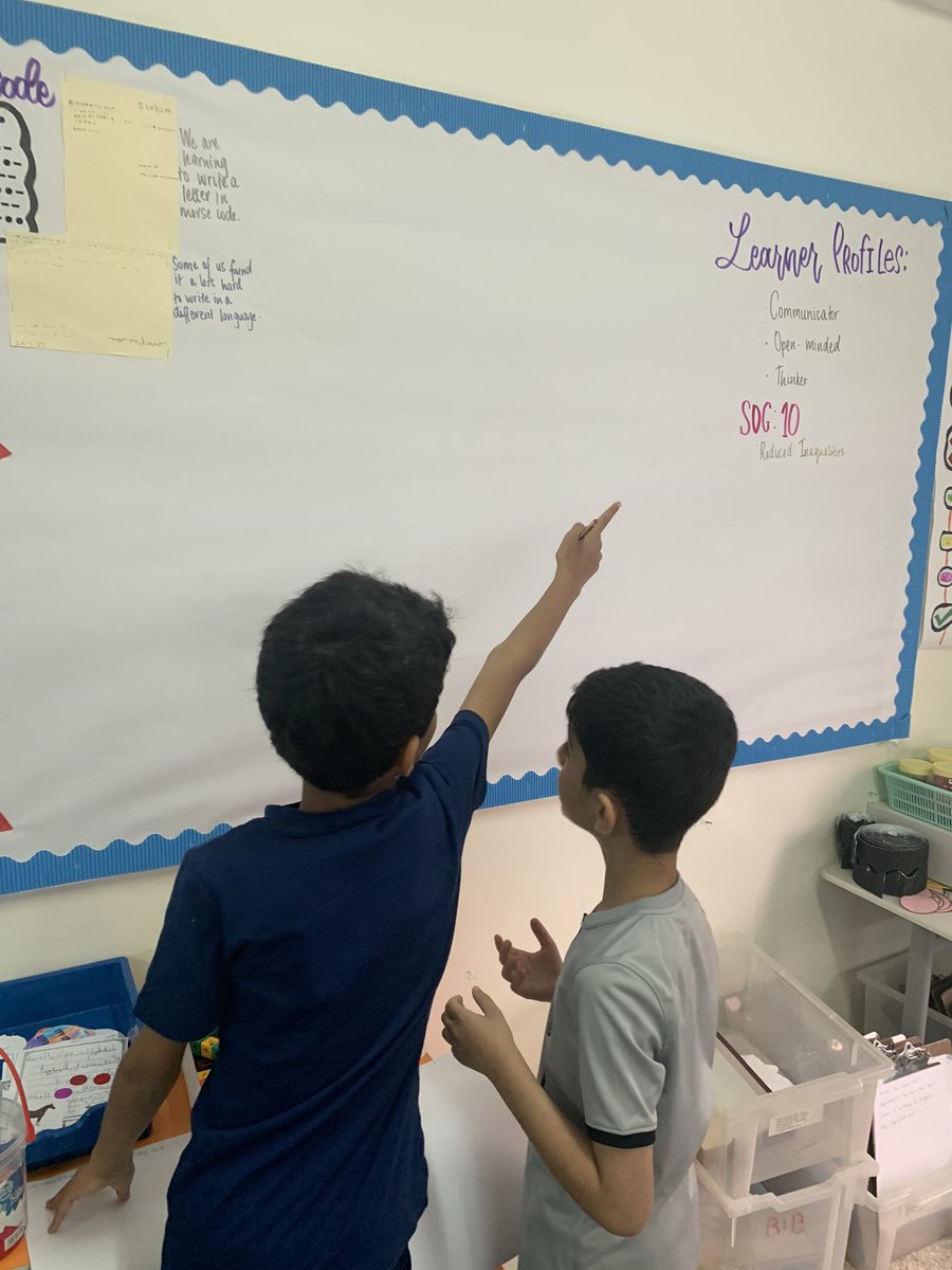 Students going to our Inquiry board to look at the learner profiles to add to their projects on communication. I’m amazed at how much they use the board to connect to their learning. #pyp #pypchat.