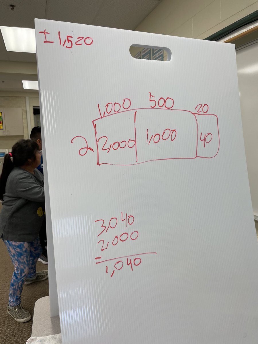 patsyacorn's tweet photo. Fourth grade teams solving division problems. @HowardGI https://t.co/uYXBk5S3mA