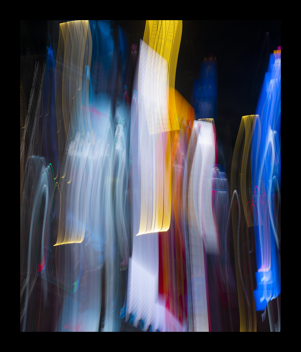 In Long Exposures, Reyle transforms the dazzling advertisements and street signs of busy city streets into captivating beams of color.
