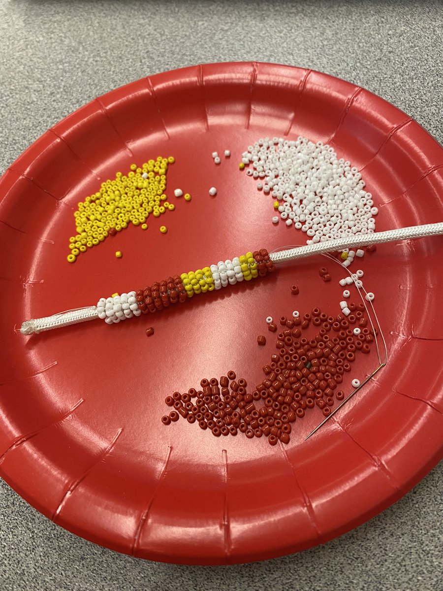 Beading workshops happening this week in #NAC1O <a href="/SaundersOne/">Saunders Secondary</a>. Students are creating mini beaded lanyard keychains. ❤️💛