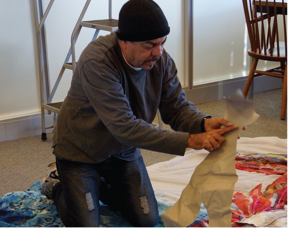 UMichLibrary's tweet photo. Such great memories of artist, educator, and library friend Rolando Estévez. "Remembering Rolando Estévez: A Cuban book artist whose work has a home at the University of Michigan" by @ruthbehar. Photo: Estévez creating an art installation in the library. https://t.co/x6DZghNjs6 https://t.co/zhK5BEm1na