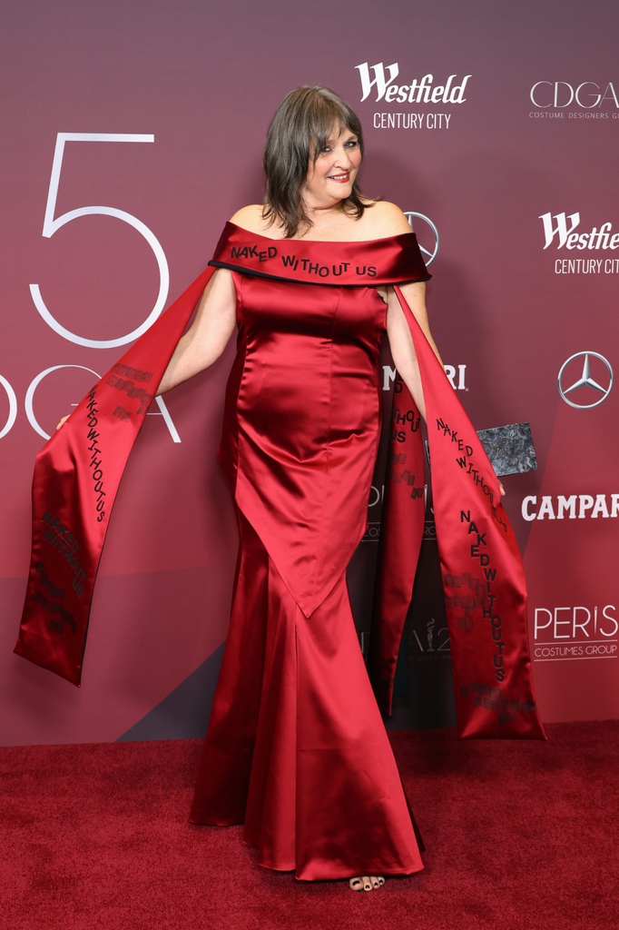 FashionWeek's tweet photo. The #CostumeDesignersGuildAwards were held in LA honoring their brilliant hard work in the TV and film industry. On the red carpet, designers #BeaAkerlund, #DawnRitz, #MandiLine, & #JennyBeavan wore outfits that called for pay equity that read out the slogans 'Naked Without Us'. https://t.co/ANwPFBvttb