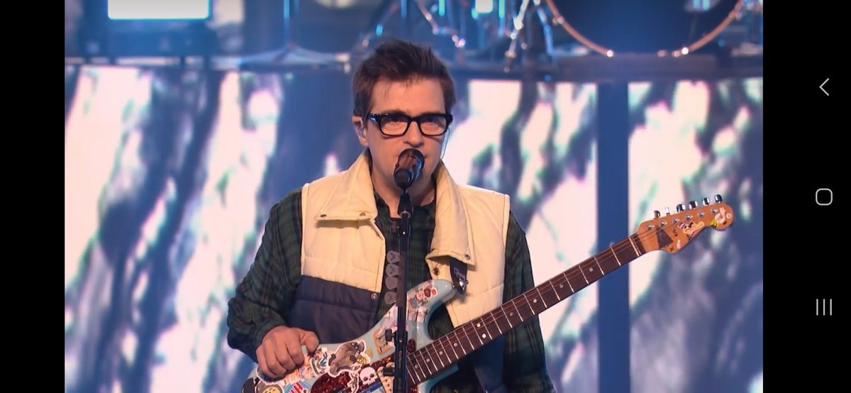 mintaburst's tweet photo. So giddy to see Rivers has the Wonder Woman manatee sticker still on his guitar I gave him on the 2nd Weezer Cruise. ❤️ #Weezer https://t.co/5UyChDQfyl
