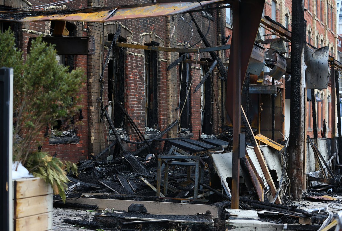 TorSunphoto21's tweet photo. Aftermath of what is being deemed a "suspicious" fire at Myth restaurant on Brant St. and King St. W that occurred around 4 a.m. https://t.co/LKSCQgvHEV #TorontoFireService https://t.co/wdXUbwo4ZJ