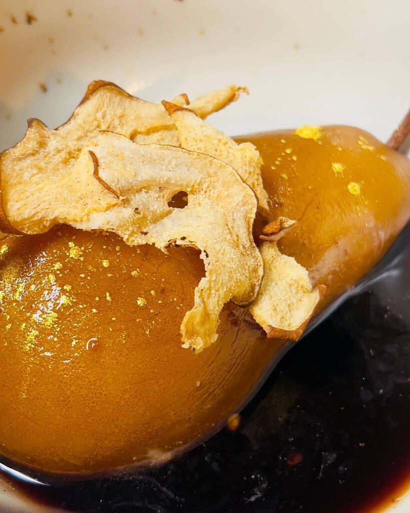 Piloncillo Red Wine poached pears - honey miso Crema with pistachios