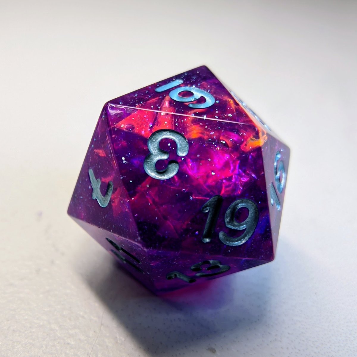 A variation on our Lyrid design. This d20 single will be available in our March restock!