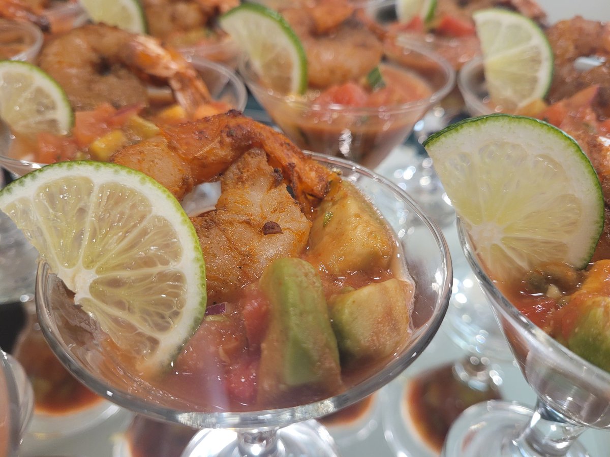 Latin Style Shrimp Cocktail. Always looking to Elevate the Bar, we put a tasty spin on a classic favorite! Crispy and fresh sauce with a grilled shrimp and lime slice served in a martini glass! Several people had a few "martini's" they were so good.