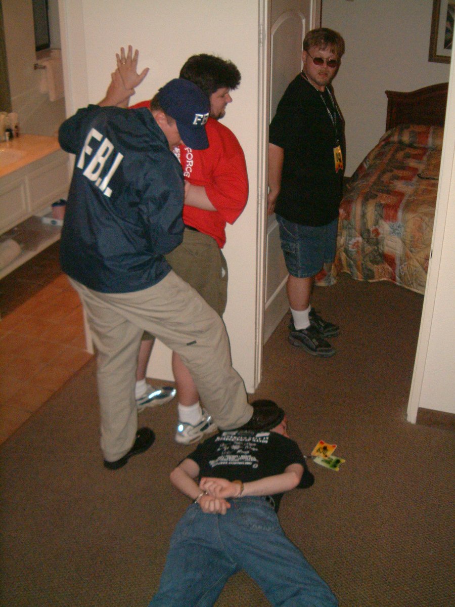 You haven't had <a href="/defcon/">DEF CON</a> fun until an actual fed agrees to stage a "taking your web site operators down" photo with the group...  (DEF CON memories from 2001, back when they actively monitored our defacement mirror for intel)