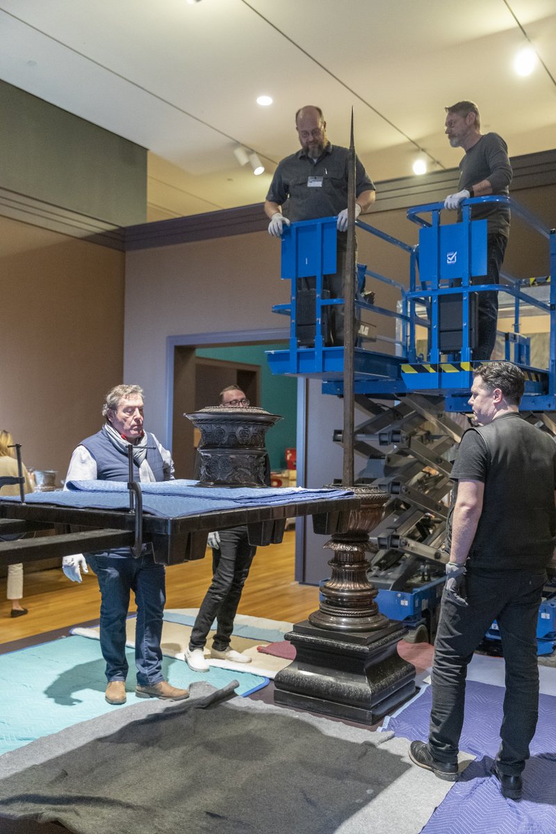 ClevelandArt's tweet photo. One at a time! 

Weighing up to 100 pounds, each section of the 9-foot bronze candelabrum at the entrance to #Tudors: Art and Majesty in Renaissance England was lifted with a forklift and gently lowered by hand over the central post. 

#CMACollectionsManagement #CMAConservation https://t.co/xY6OlsrRKp
