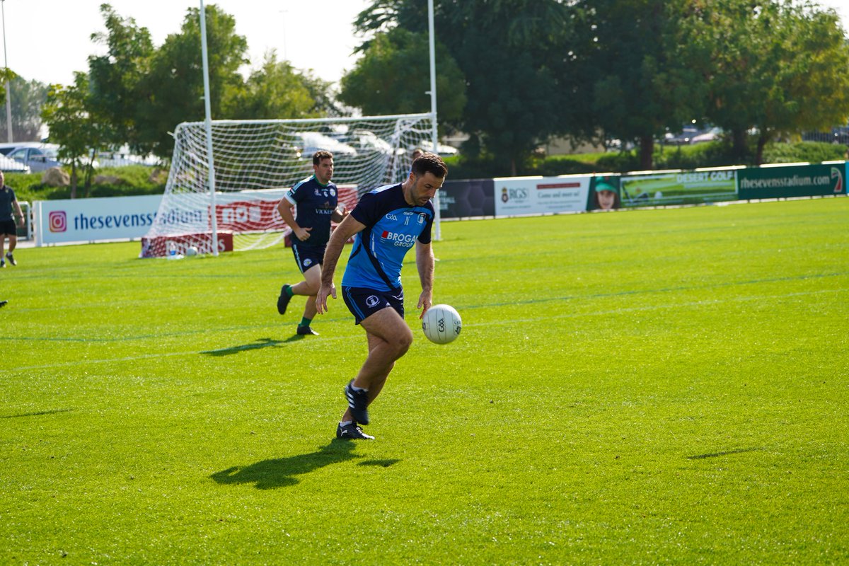 Robbie Corcoran of Gusserane O' Rahillys and RAK Ropairí solos out of defence against Abu Dhabi Na Fianna in round 4 of the Middle East Junior Football league in Dubai last Saturday morning . #worldgaa #gaabroad
