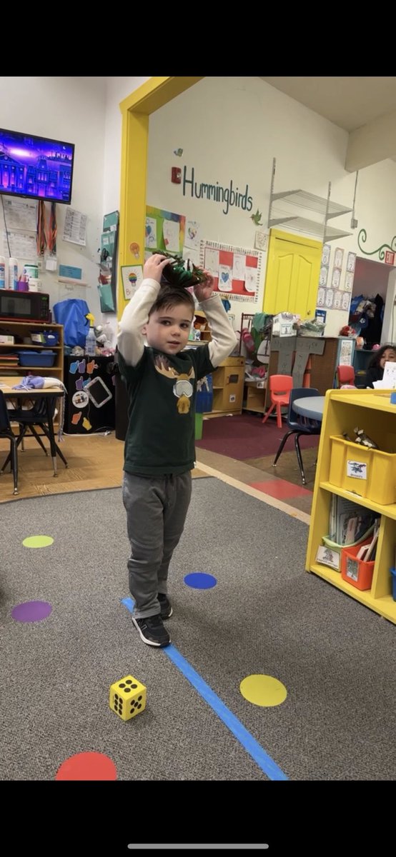 ProjectBeforeGF's tweet image. These preschoolers LOVED the book “There is a Bird on Your Head!” They extended the story and told their friends what was on their heads! Then they took turns rolling dice and walking with a birds nest on their heads!
