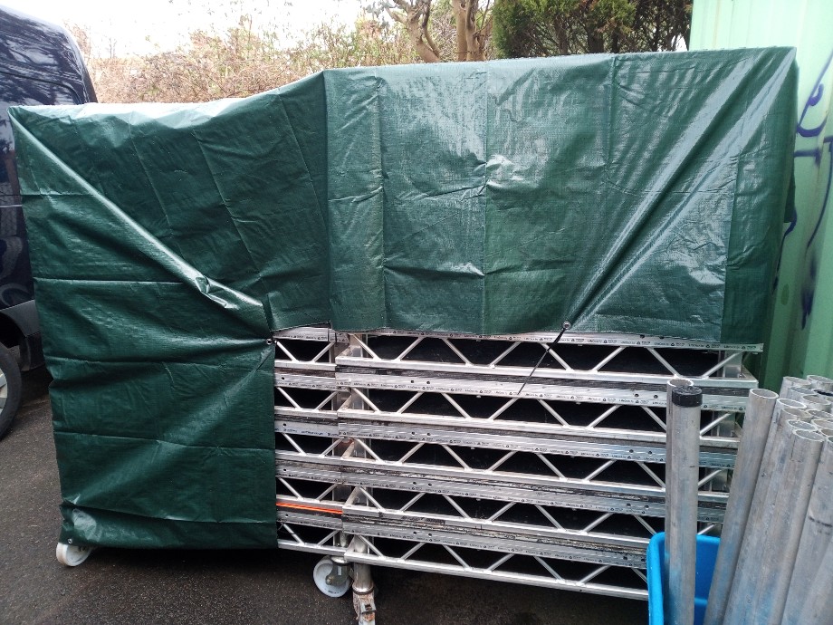 OooshTours's tweet photo. Hello, what's under this tarp, eh? 

We spent most of last year having to say "no" to the huge number of staging &amp; risers requests - so I'm super glad we just managed to bag an extra 18 pieces of 8x4! 
.
.
#litedeck #festivalproduction #eventproduction #backlinehire #oooshtours https://t.co/sAcwq9zsZt