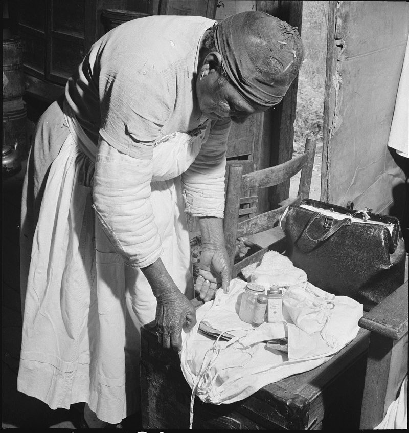 A midwife wrapping her kit to go on a call in Greene County, #Georgia, 1941. Prints and Photographs Division, Library of Congress. Photographer: Jack Delano, (1914-1997).