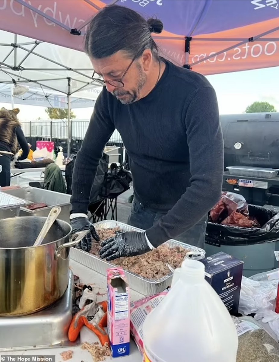 Legendary Foo Fighters singer Dave Grohl helping homeless people in California by putting on a barbeque for them at the Los Angeles charity The Hope Mission