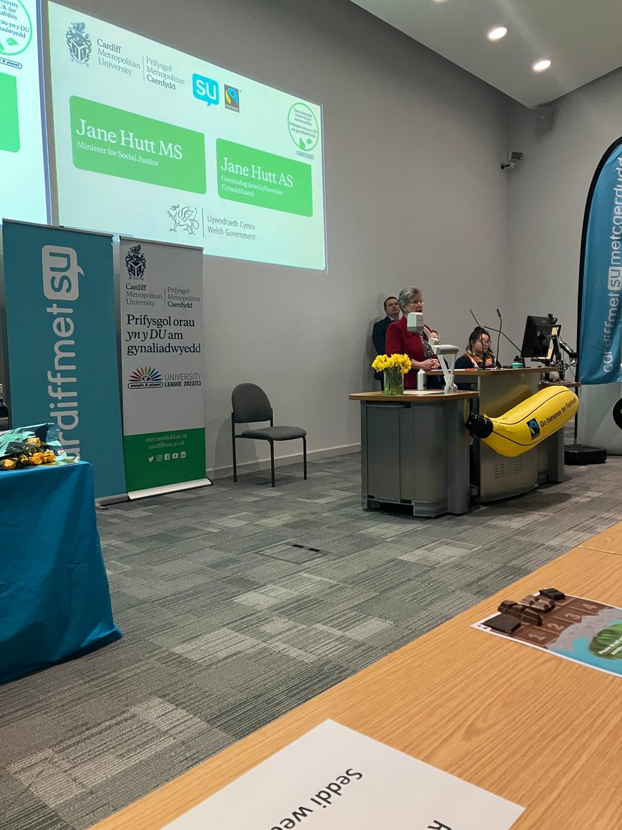 WG_HousingLG's tweet photo. Today, @JaneHutt spoke at @cardiffmet’s Fairtrade Fortnight event celebrating its Fairtrade status and new top place ranking in the @peopleandplanet University League!🗣️🥇 https://t.co/ZgDHRWiyUk