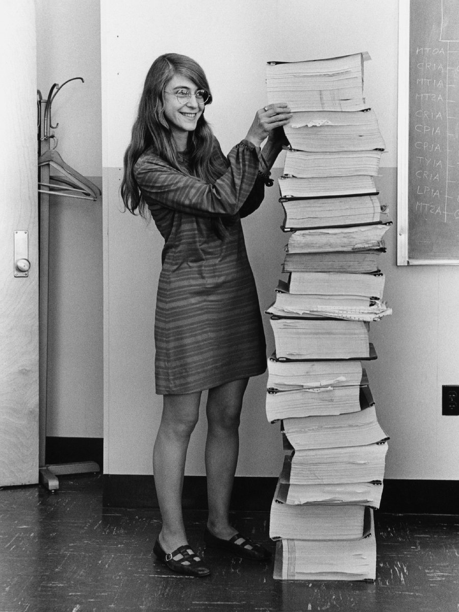 codeorg's tweet image. March is #WomensHistoryMonth! This is Margaret Hamilton, leader of the MIT team responsible for developing in-flight software for the Apollo moon landing in 1969. In this photo, she&apos;s standing next to the code that she and her team wrote by hand! 

#RoleModelsinCS #WomeninSTEM